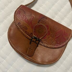 Vintage Brown Embossed Leather Bag with long strap.